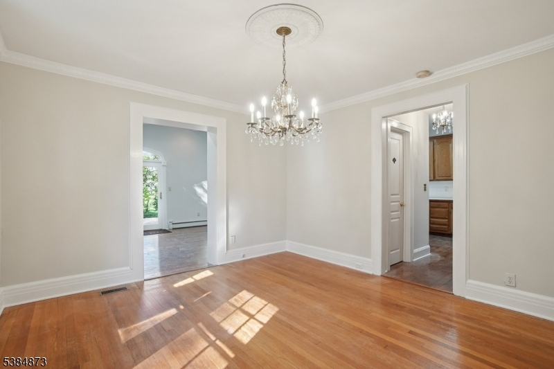 Dining Room open from living room to butler's pantry/kitchen and great room/family room for amazing entertainment flow & use.