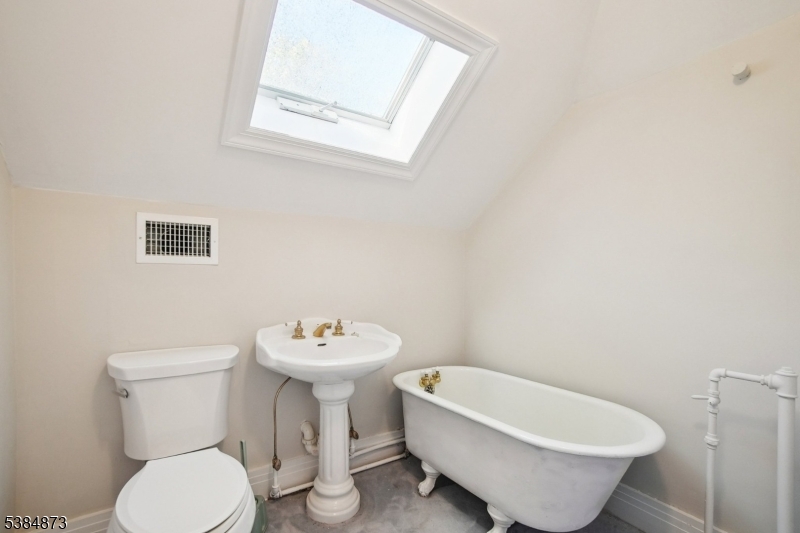 Full Bath Third floor ensuite bath with skylight and soaking tub