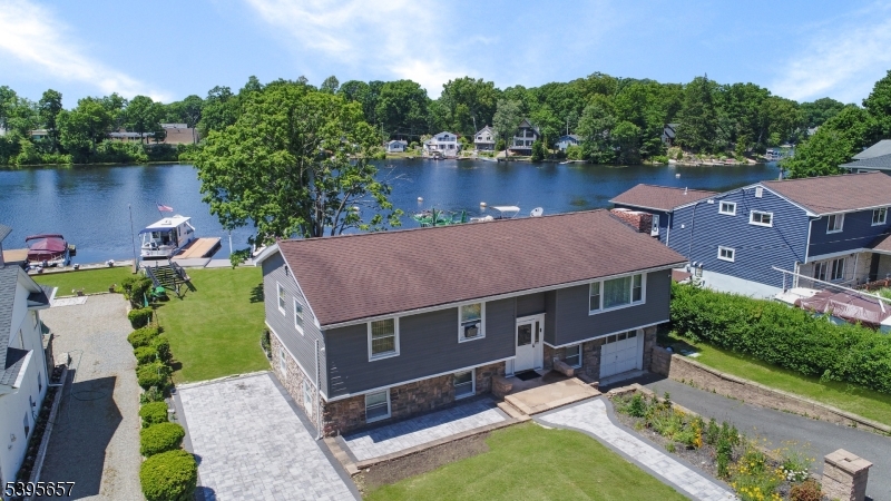 Front View Fabulous Lakefront on a flat lot!