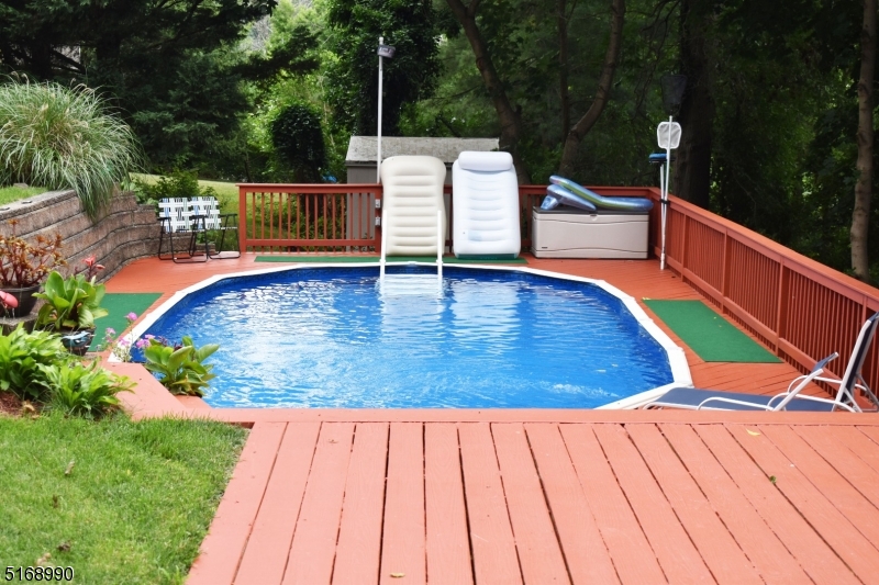 Above ground pool with deck surrounding- new liner!