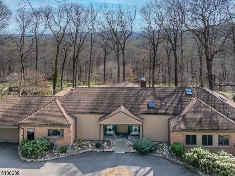 Welcome to 235 Mountainside Rd Reached by a long driveway, this 14-acre property offers amazing privacy.