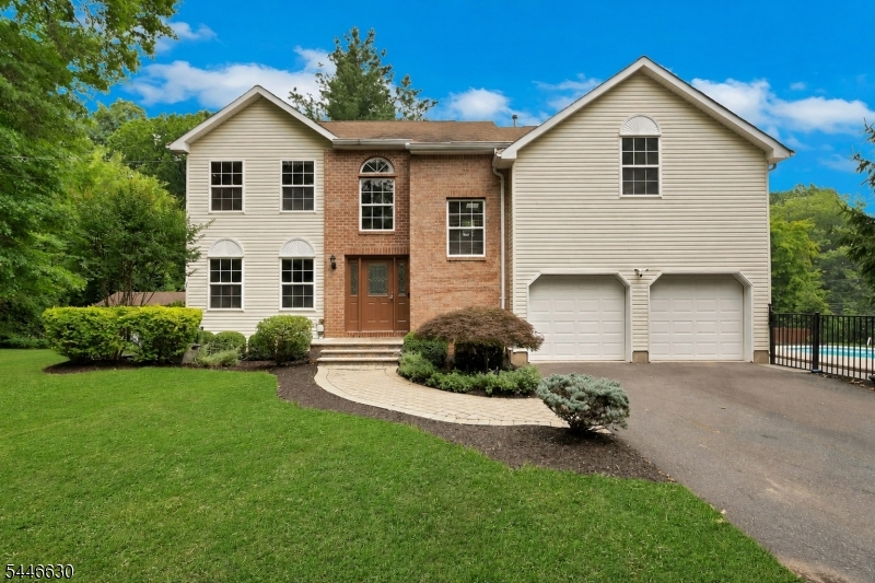 Updated Colonial Modern home with saltwater pool, fully updated throughout. (Virtually staged without the basketball net)