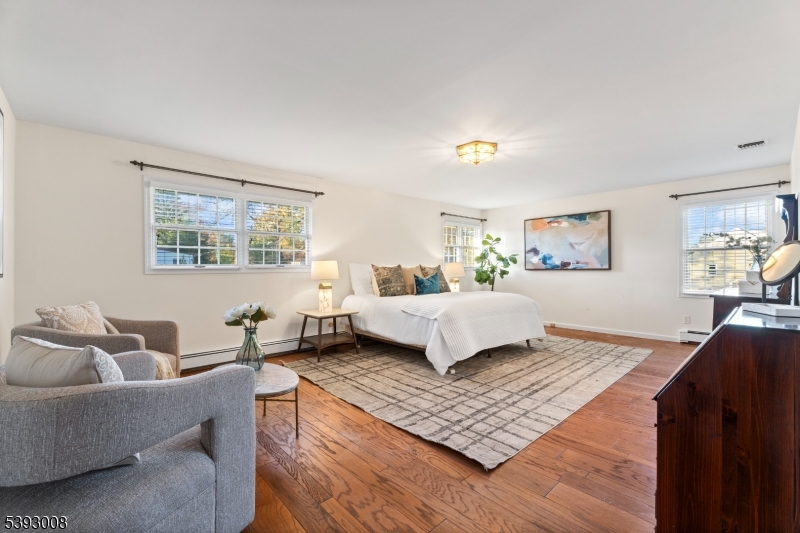 Primary Suite 23x16 w/ WIC, dressing area, spa-like bath & plenty of room for home office and/or sitting/excerise area