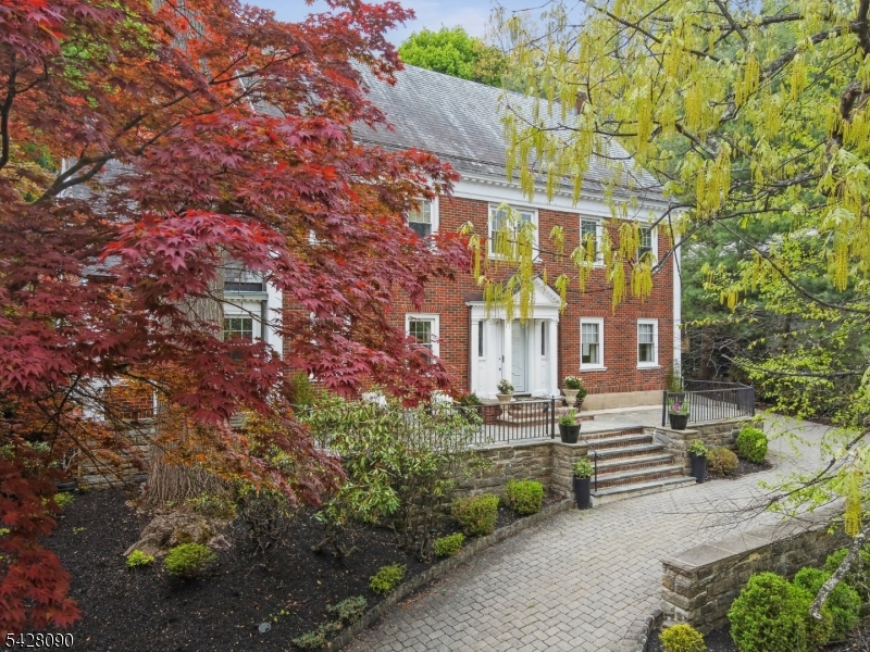 Set above it all, this timeless brick Georgian makes a quiet, confident statement - a home where classic architecture and natural beauty come together in perfect harmony.