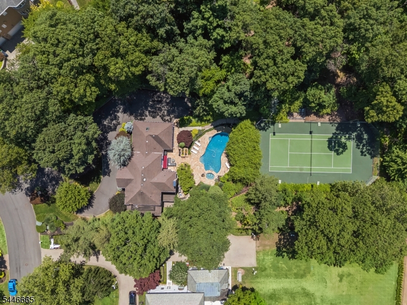 Location, Location! Located on a cul-de-sac with the most beautiful property, which includes a resort-style pool and tennis court.