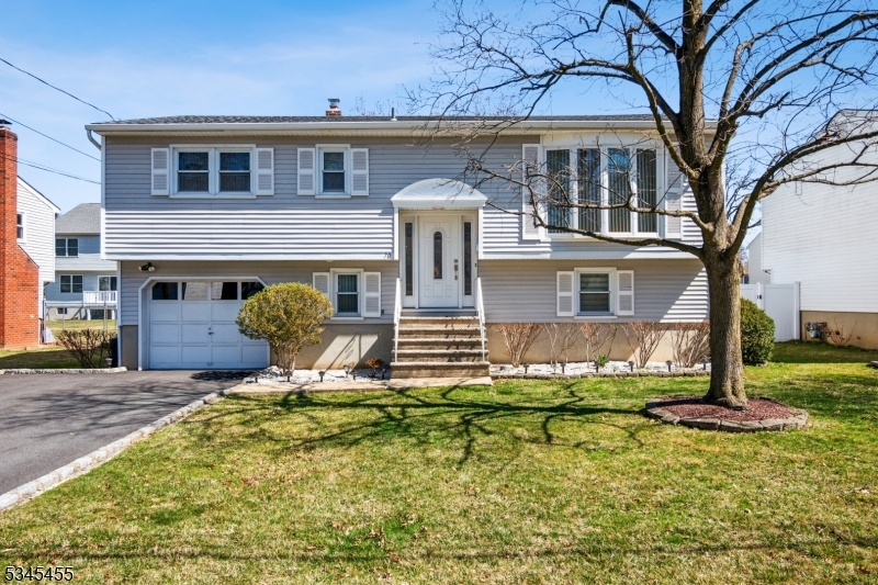 Charming curb appeal meets timeless design in this beautifully maintained bi-level home nestled in the Lake Parsippany community.