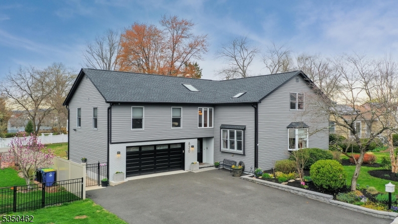 EXTRA WIDE DRIVEWAY, NEWER ROOF, SIDING AND GUTTERS
