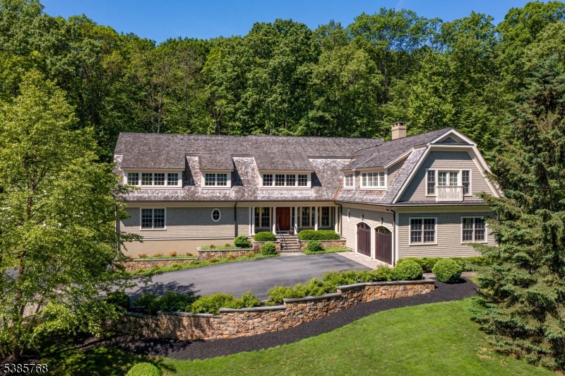 This stunning 12-room, 4-car garage Shingle Style Residence, 2010, is sited on almost 7AC on the Bernardsville Mountain. Note the fieldstone walls. Residence designed by noted architect Nick Cusano.