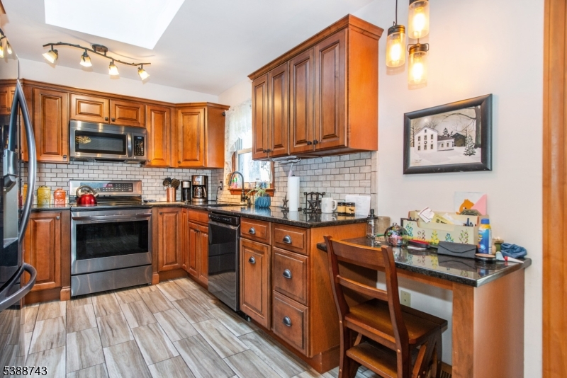 Kitchen desk areakylights,hardwood,wood burning stove