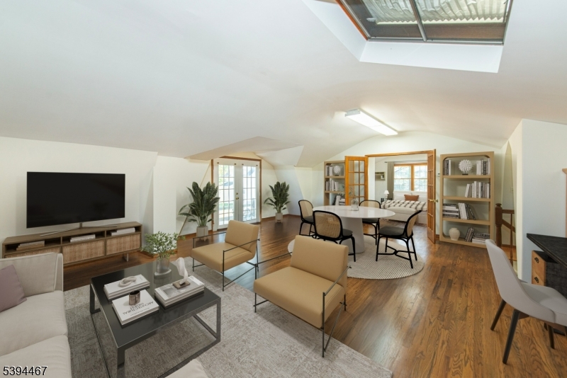 Living Room/In-Law Suite Located above the 3 car garage, virtually staged