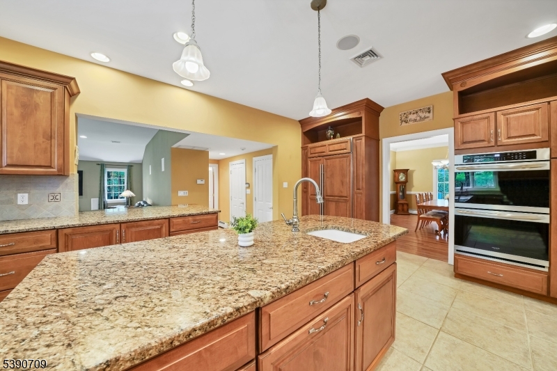 Kitchen w/ Center Island Plenty of cabinetry and counter-space with stainless appliances