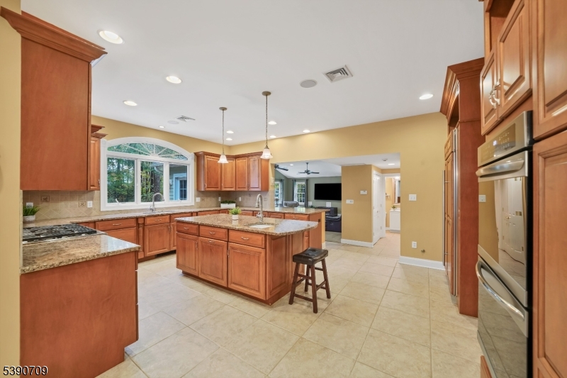 Kitchen w/ Center Island Plenty of cabinetry and counter-space with stainless appliances