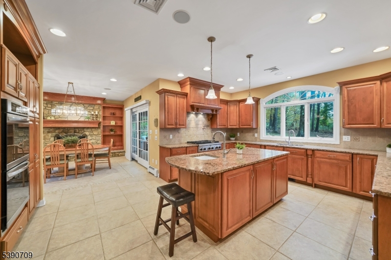 Kitchen w/ Center Island Plenty of cabinetry and counter-space with stainless appliances