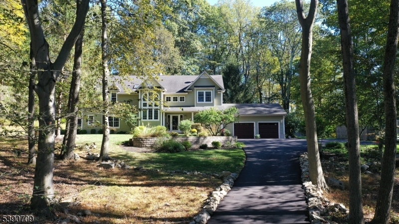 View of Home from Street Private wooded setting