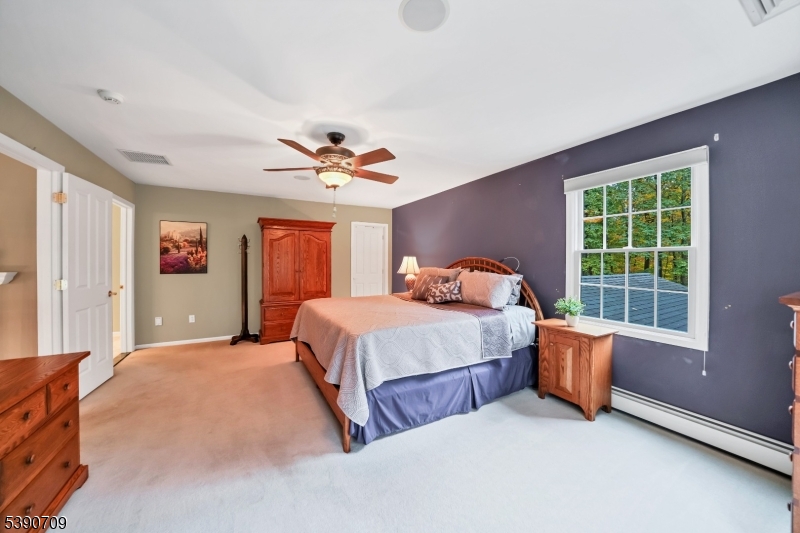 Primary Bedroom Suite Two walk-in closets and primary bathroom