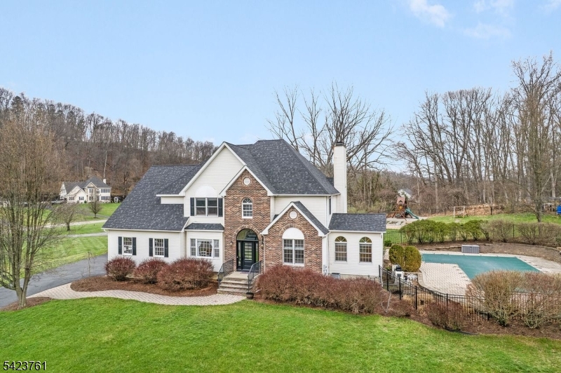 1.74 acres with heated pool and fenced in back area.