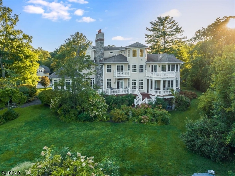 Enjoy stunning, unobstructed views of Wildwood Lake from every room. This lakefront luxury home offers a perfect blend of serene waterfront living and high-end elegance, making it the ideal retreat for those seeking beauty and tranquility.