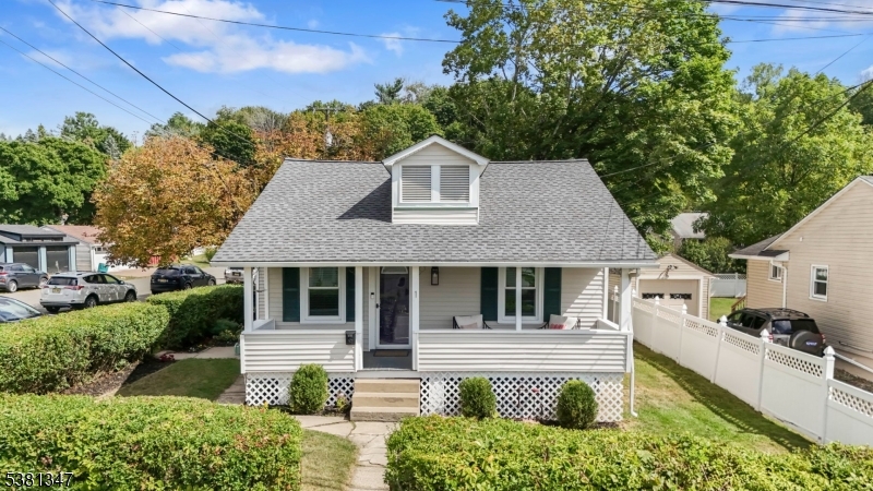 Beautiful corner lot with mature landscaping and new roof!