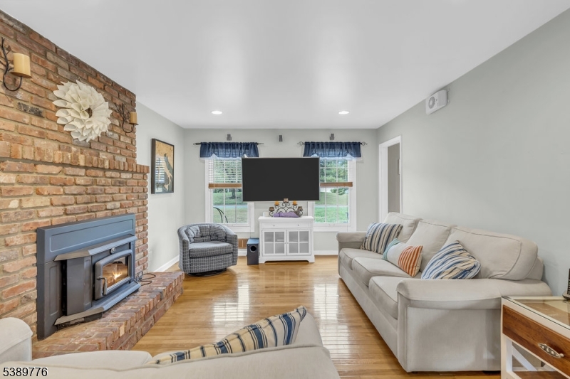 Family Room with HW floors Wood burning fireplace insert