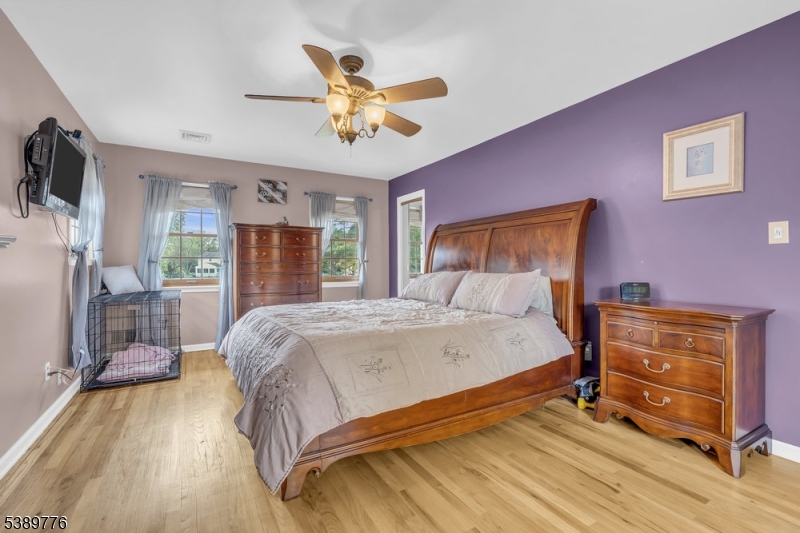 Primary Bedroom Hardwood floors, full bath, walk in closet