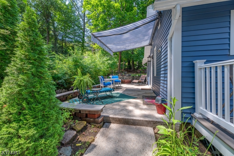 Patio with awning off kitchen With automatic, retractable awning