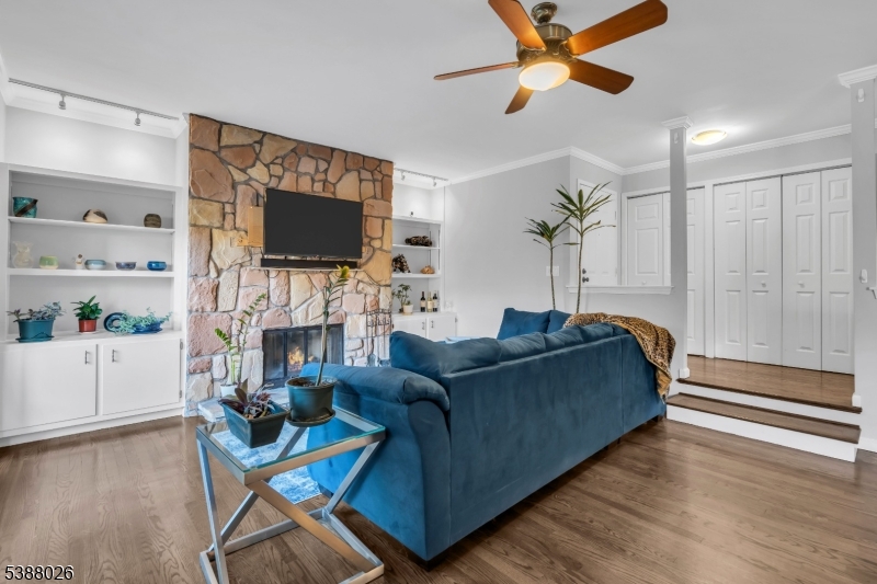 Living Room Floor to ceiling wood burning fireplace