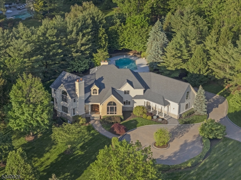 Set on an expansive 1.9-acre lot on one of Warren Twp's most desirable streets, this Ferruggia built & Beer Coleman designed home is crafted with architectural distinction and quality finishes thru-out.