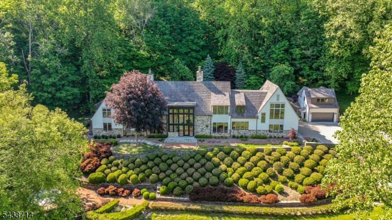171 Campbell Road Approximately 10,735 sq.ft situated on 12.45 acres in Bernardsville, NJ. The estate features 5 bedrooms, 6 full bathrooms, 3 half bathrooms, a carriage house guest suite, and garage capacity for up to 7 vehicles, and beautiful maintained grounds.