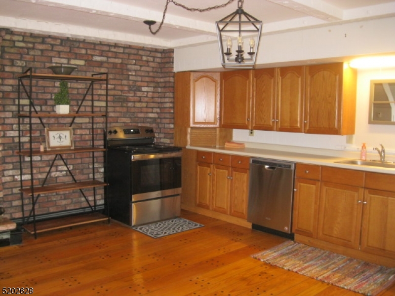 Fully equipped kitchen with all newer stainless steel appliances.
