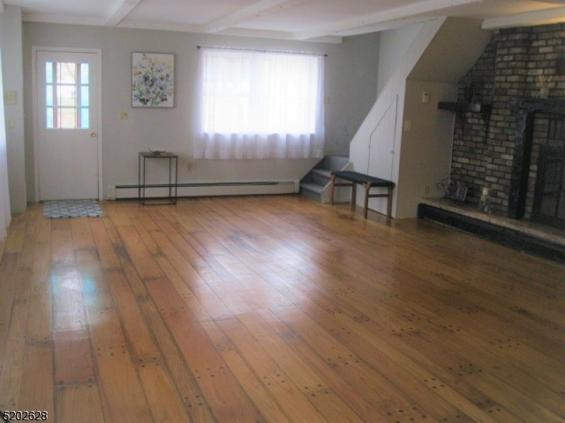 Enjoy the open floor plan and beautiful original hardwood floor.