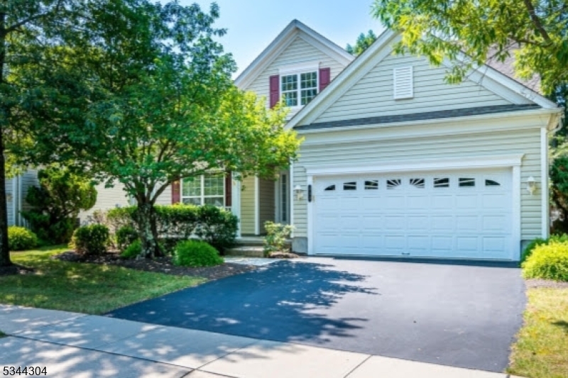 2 car width Black Top Driveway. Decorative 2 car garage. Front porch. Clean crisp look.