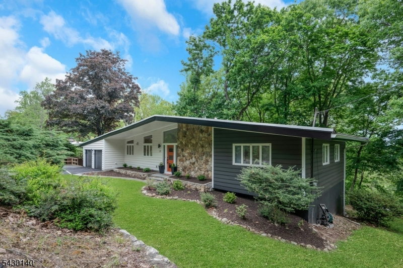 Welcome to 29 Skyline Drive This home showcases a bold architectural style with clean lines, dramatic angles, and expansive windows designed to bring the outdoors in.