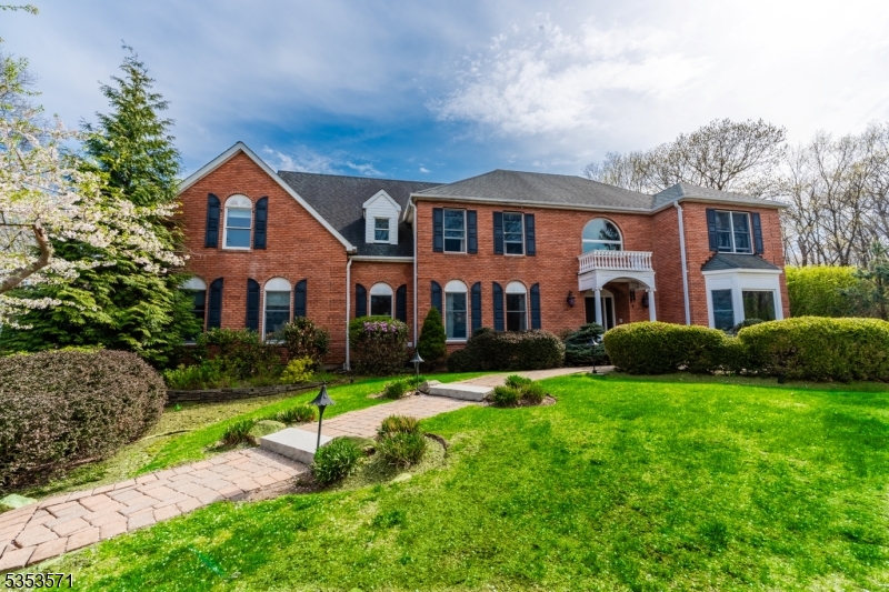 Stately Brick Colonial set back on 2.38 acres of beautifully landscaped property. Ideal location near Route 15, shopping, and dining.