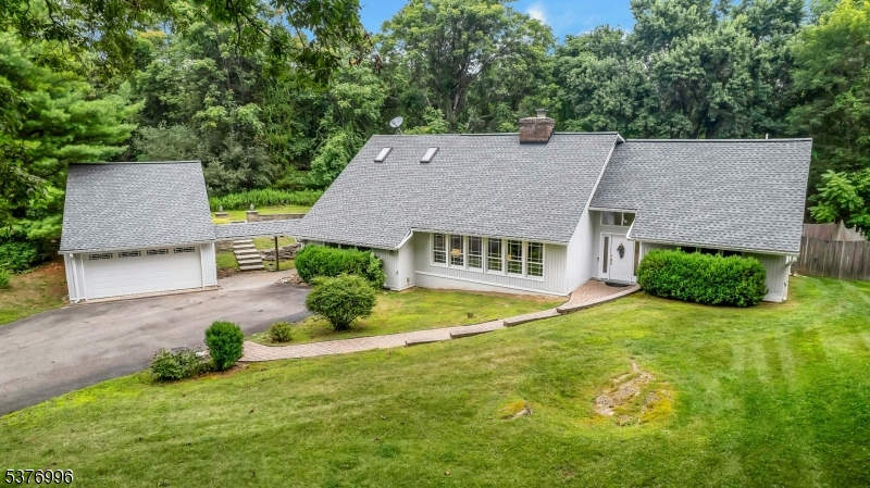 Custom Home with Oversized two car garage with additional storage on the second floor. Workshop, billiards room, storage for toys and tools