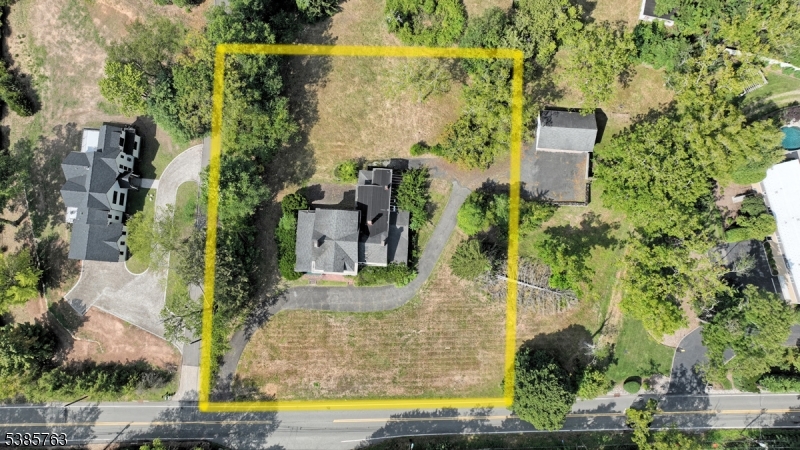 Aerial of 1 acre lot with home