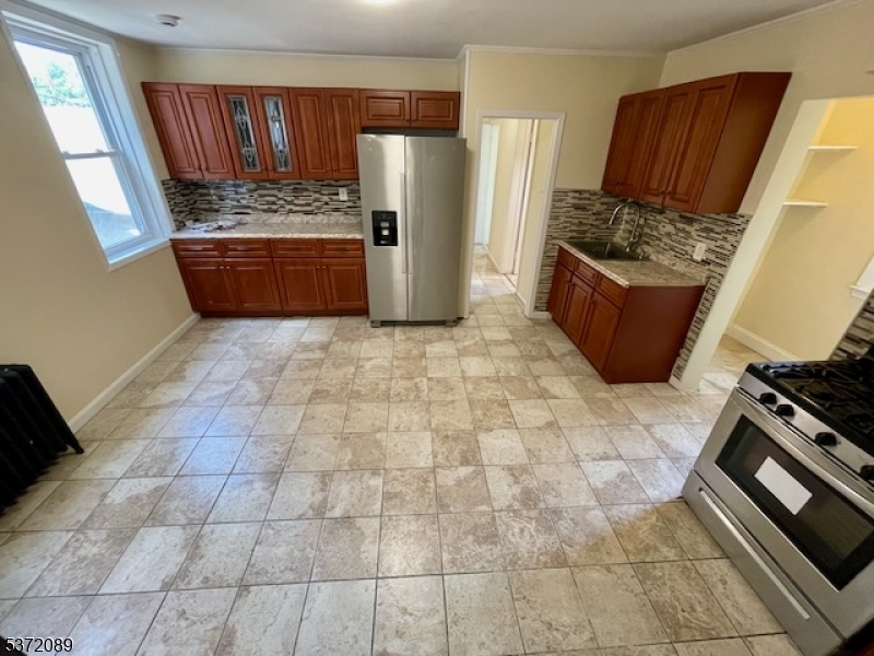 Stainless steel sink and appliances. Large eat-in-kitchen