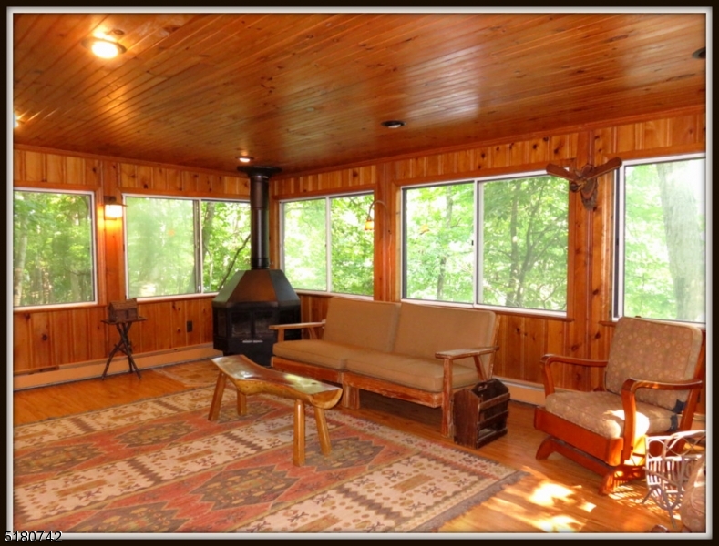20 X 14 family room overlooking the lake, with a woodstove to take the winter chill off