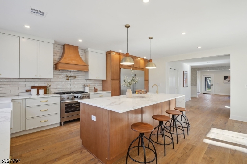 Expansive island is the heart of the kitchen. Storage on both sides.