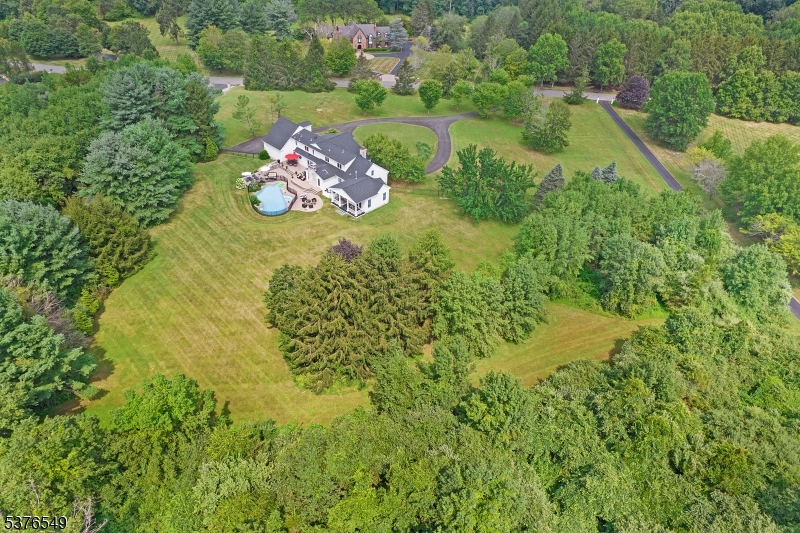 Lovely yard with mature trees give this property a private feel while being in a neighborhood setting