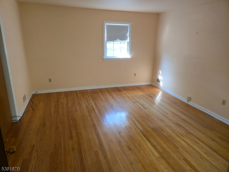 Primary Bedroom Hardwood Floors