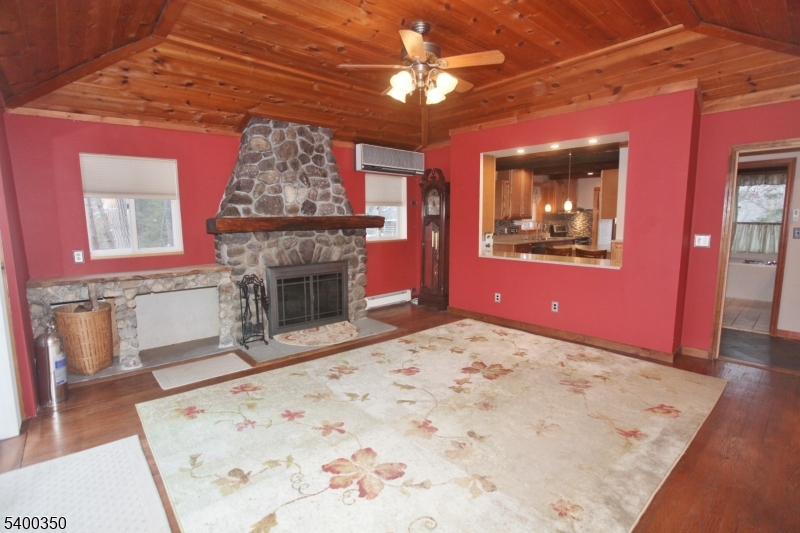 Living Room With Cozy Fireplace and Showing Pass Through to Kitchen!