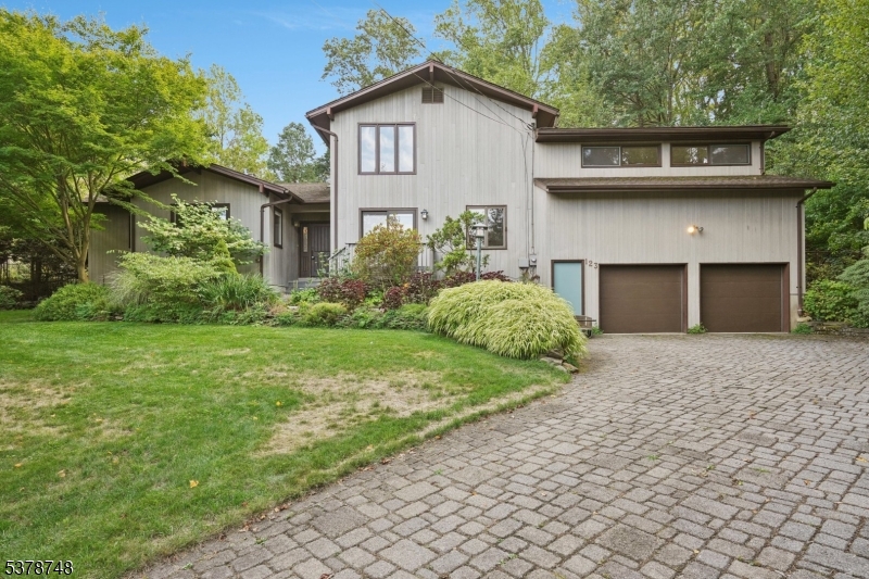 Front view of the home with paver block driveway.