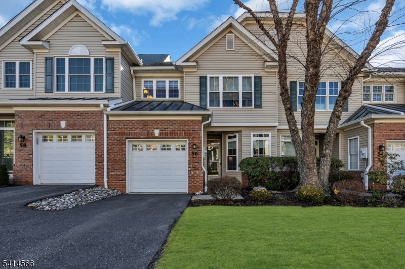 Welcoming lawn with private driveway and one car garage