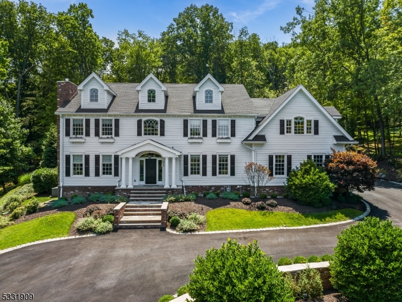 Breathtaking custom built 5 bedroom, 4 bathroom, 2 half bathroom Colonial exudes luxury and elegance.