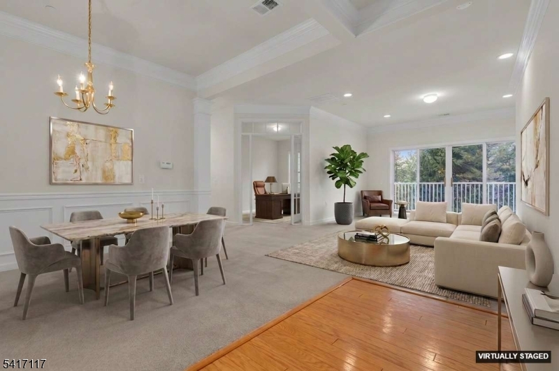 9' ceiling, crown molding, recessed lights, HWF in the foyer, wainscoting in the dining room. Unit is freshly painted.