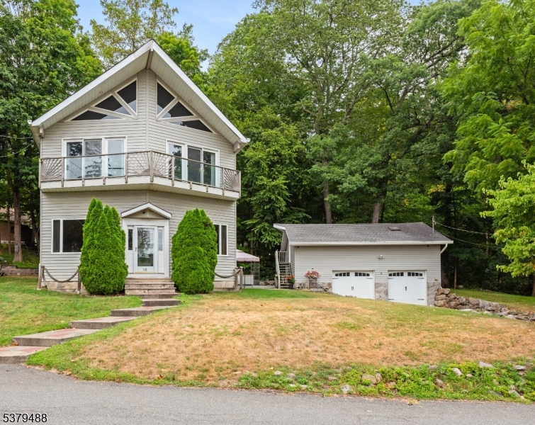Detached heated garage with tons of storage above!