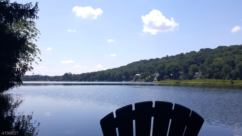 Unobstructed views from dock on subject property. Dock is steel I-beam cantilevered substructure with wood top boards. approx 100 ft lake front with concrete bulkhead. 3 tier level terraced lakefront