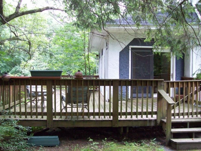 Come and relax!! Deck is accessed from 3 season porch.