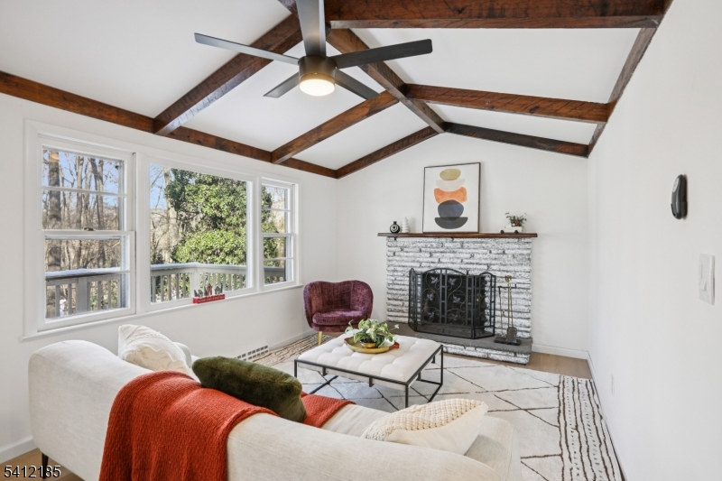 high beamed ceilings and wood burning fire place