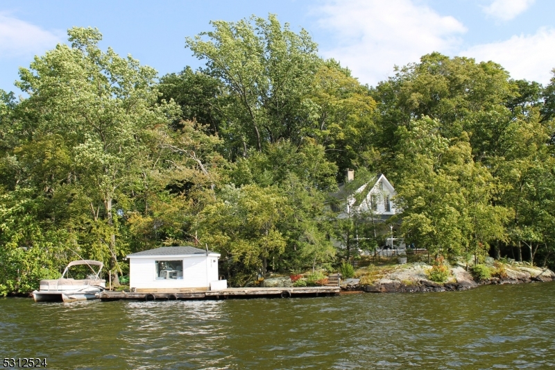 This vintage home is located on Raccoon Island in Lake Hopatcong, less than 1 hour from NYC.